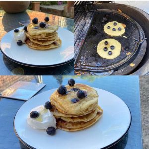 Delicious blueberry pancakes with ice cream topped with honey